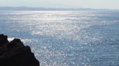 The sea shines from the sun. Calm, view from the mountain.Beautiful landscape. The concept of vacation, tourism, travel, coast, nature, environment, tour, meditation, footage,resort, summer,countries.