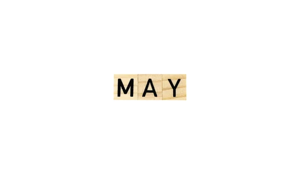 The word may in wooden letters on a white background. Concept text, season, congratulation, spring, holiday, discounts, promotions, design, eco, copy space, poster,mock up,month,calendar,business,date