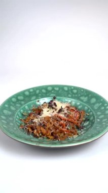 Close-up, spaghetti sprinkled with grated cheese
