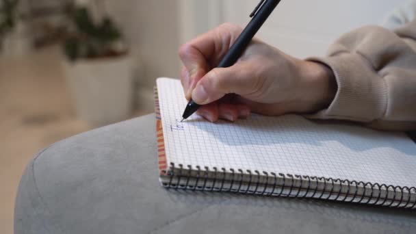 Woman Writes Out Her List Ensuring She Doesn Forget Any — Vídeos de Stock
