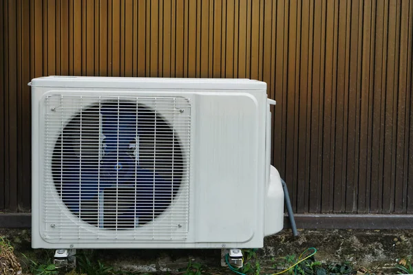 Outdoor air condition  unit compressor install outside house\'s wall. Concept: appliance for office and house. Various brands to buy in Thailand. Durable and reasonable price .