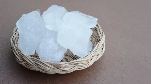 Crystal clear alum stones or Potassium alum on basket .Useful for beauty and spa treatment. Use to treat body odor under the armpits as deodorant and make water clear.      