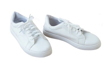 Pair of new white shoes, sneakers isolated on white background. Concept, unisex footwears fashion. Daily life wearing for traveling, doing sport. Go with comfortable shoes.      