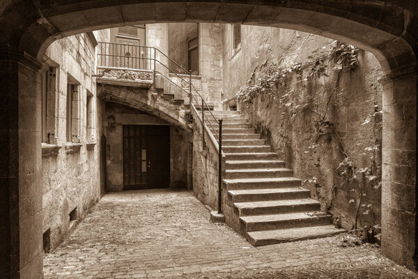 A view of a passageway and steps in Gironas Old Town and Jewish Quarter. High quality photo