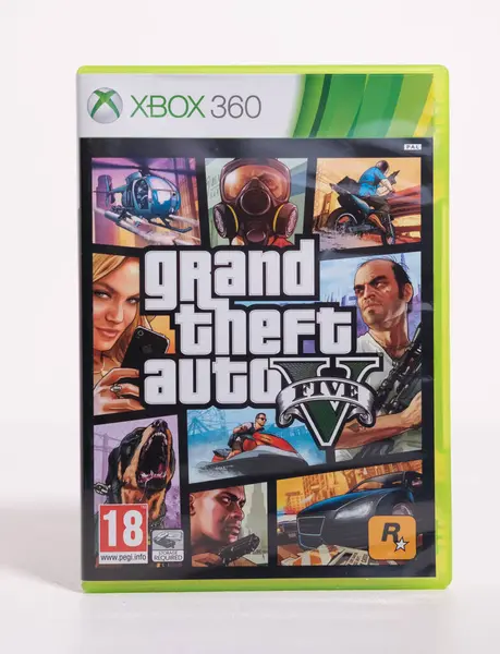 stock image Kent, england, 01.01.2023 An original grand theft auto 5 XBOX Microsoft video retro vintage game disc and case. Original xbox console gaming. Rare vintage video games.