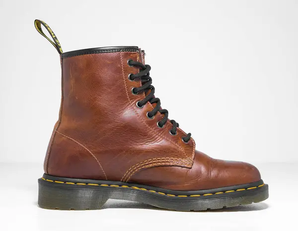 stock image kent, uk 05.05.2023 Dr Martens 1460 dark tan Leather Boots 8 Eye lace hole. fashionable punk historic british made leather boots. dr martens air ware with bonding soles. built to last. 