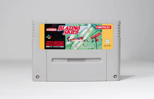 Stock image london, uk 03.03.2020 Nintendo snes Blazing Skies rare super nintendo official original video game cartridge on a white isolated background. iconic retro super famicon gaming machine. 