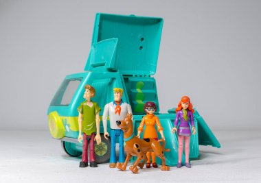 london, uk, 05.05.2020 The scooby doo mystery machine truck van, from Hanna Barbera toys with the scooby doo character scoobert scooby doo, velma dinkley, daphne blake, shaggy rogers, fred jones and scrappy doc.  clipart