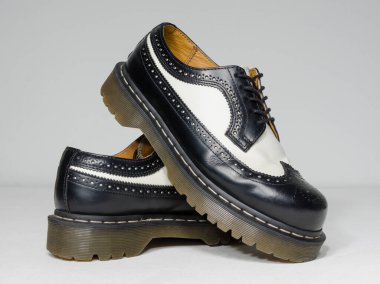 london, england, 05/05/2019 Dr Martens 3989 bex smooth leather brogue shoes  fashionable punk historic british made leather boots. dr martens air war with bonding soles. built to last.  clipart