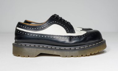 london, england, 05/05/2019 Dr Martens 3989 bex smooth leather brogue shoes  fashionable punk historic british made leather boots. dr martens air war with bonding soles. built to last.  clipart