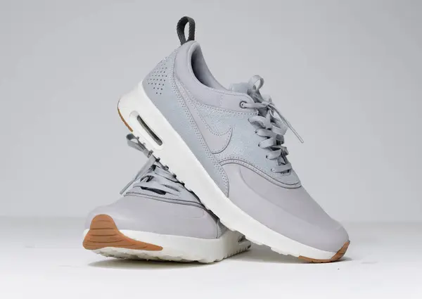 stock image london, uk 05/08/2018 Nike Air Max thea Cool Grey Sail Metallic Pewter running trainers. Nike air contemporary sneaker trainers. Nike sport and street wear fashionable athletic apparel. Isolated nikes.