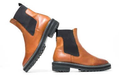 london, england, 05/05/2019 brown tan Leather Chunky Chelsea Boot ankle boot. fashionable punk historic british made leather boots. dr martens air ware  clipart