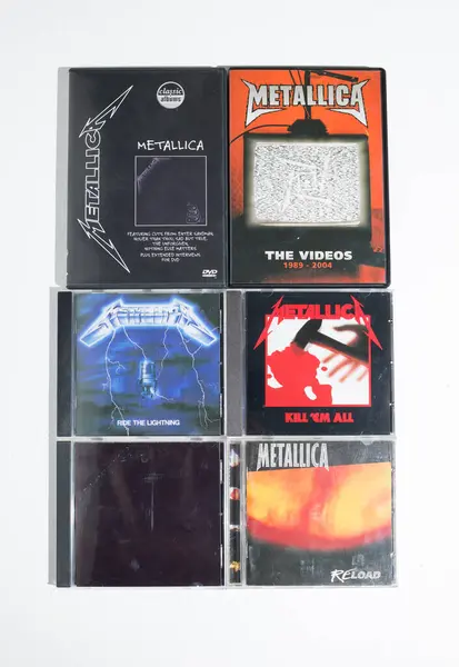 stock image kent, uk 01.01.2023 A collection of death heavy metal Metallica cd collection. Vintage rock music cd bundle collection on a white background.