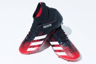 kent, uk 01.01.2023 Adidas Predator 20.3 Dragonscale Red firm ground Football Boots. iconic soccer shoes. turf field soccer boots. clipart