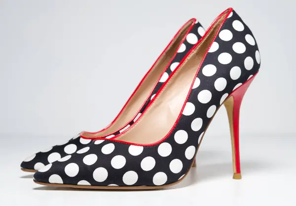 stock image kent, uk, 01.01.2023 Dune brand Ladies Shoes Dune white black and red Polka dot high heel stiletto footwear. fashionable beauty and costume play erotic shoes.