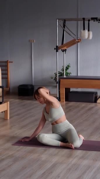 Young Sporty Attractive Woman Doing Mermaid Pilates Exercises Wearing Sportswear — Stock Video