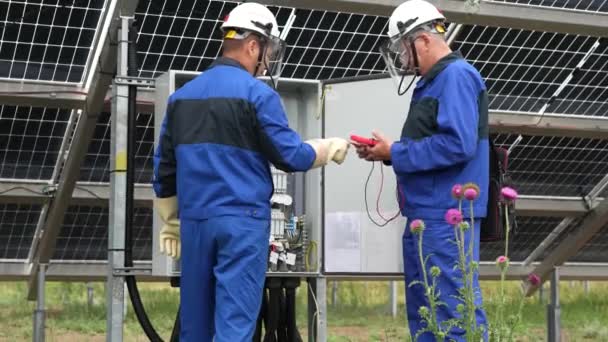 Two Service Engineers Electrician Working Checking Transformer Site Solving Problem — Stock Video