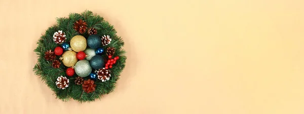 Christmas background. Festive wreath with Christmas balls, top view. New year banner to add text
