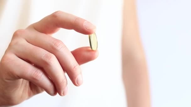 Medicine Capsule Female Hands Omega Bright Yellow Transparent Vitamins White — Stock Video