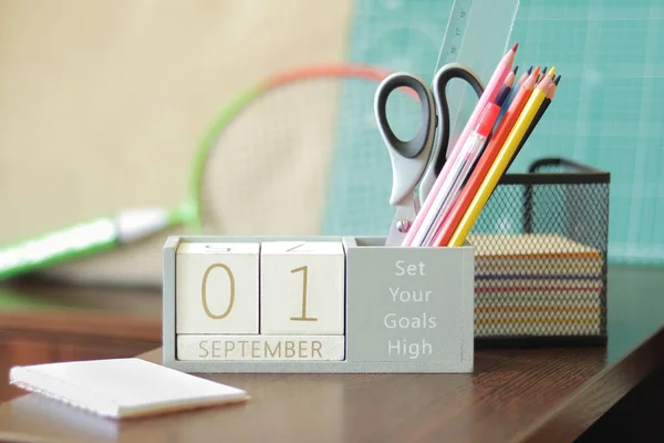 Calendar, September 1st. Back to school. Wooden perpetual block calendar for the table, wooden blocks for displaying the date of the month