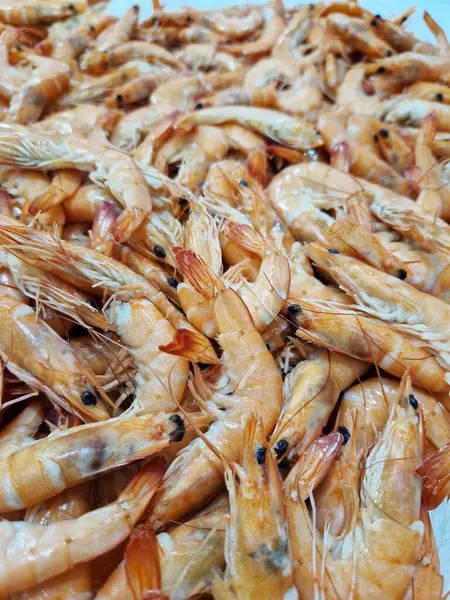 Chilled boiled shrimp in a supermarket or grocery store, close-up video. Seafood