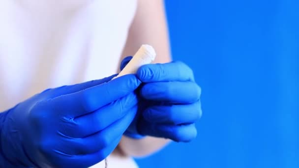 Female Hand Tampon Close Blue Background Hand Blue Latex Medical — Stock Video