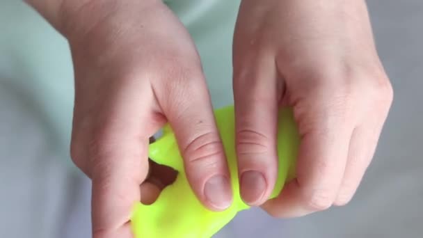 Girl Kneads Yellow Mucus Woman Hands Stretch Bright Yellow Slime — Stock Video