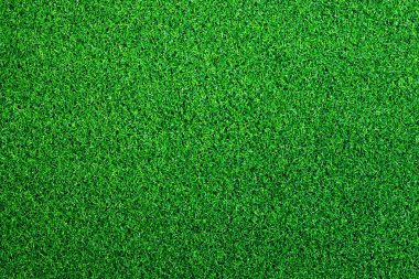 Yapay ot, kaplama. Yapay yeşil çimen paspası, üst manzara. Doku. Geçmişi. Suni çim, yapay liflerden yapılmış yüzey. Düz yeşil çimen dokusu. Kısa çimen