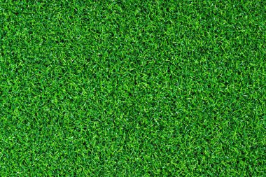 Yapay yeşil çimen paspası, üst manzara. Doku. Suni çim, yapay liflerden yapılmış yüzey. Düz yeşil çimen dokusu. Kısa yapay golf sahası