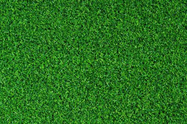 Yapay yeşil çimen paspası, üst manzara. Doku. Suni çim, yapay liflerden yapılmış yüzey. Düz yeşil çimen dokusu. Kısa yapay golf sahası