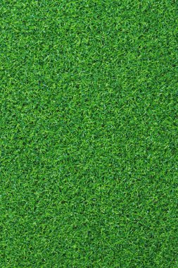 Yapay yeşil çimen paspası, üst manzara. Doku. Suni çim, yapay liflerden yapılmış yüzey. Düz yeşil çimen dokusu. Kısa yapay golf sahası
