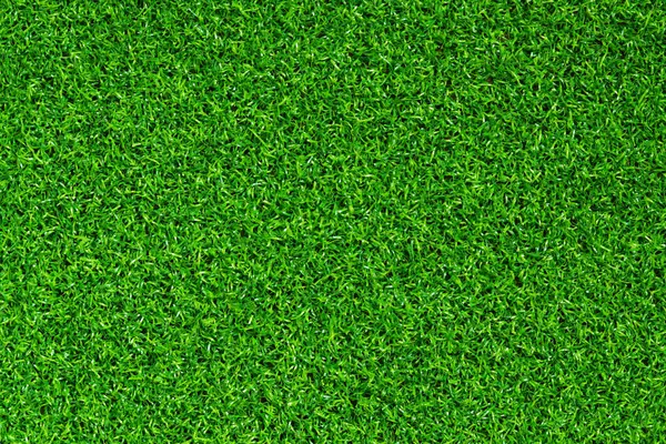 Yapay yeşil çimen paspası, üst manzara. Doku. Suni çim, yapay liflerden yapılmış yüzey. Düz yeşil çimen dokusu. Kısa yapay golf sahası