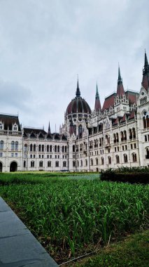 Budapest, Hungary - September 15, 2024. Hungarian Parliament Building in autumn. Neo-Gothic. Architectural landmark of Budapest. Part of the Hungarian Parliament Building in Budapest clipart