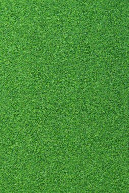 Yapay ot, kaplama. Yapay yeşil çimen paspası, üst manzara. Doku. Geçmişi. Suni çim, yapay liflerden yapılmış yüzey. Düz yeşil çimen dokusu. Kısa çimen