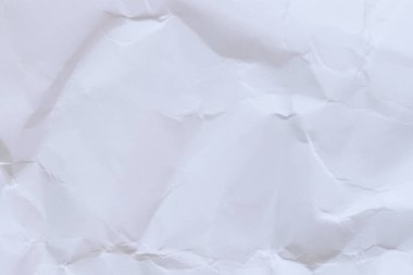 Buruşmuş beyaz kağıt arka plan. Buruşmuş beyaz kağıt dokusu ya da kağıt arkaplan. Kopyalama alanı olan ışık arkaplanı. Üst görünüm