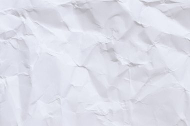 Buruşmuş beyaz kağıt arka plan. Buruşmuş beyaz kağıt dokusu ya da kağıt arkaplan. Kopyalama alanı olan ışık arkaplanı. Üst görünüm