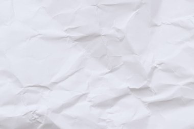 Buruşmuş beyaz kağıt arka plan. Buruşmuş beyaz kağıt dokusu ya da kağıt arkaplan. Kopyalama alanı olan ışık arkaplanı. Üst görünüm