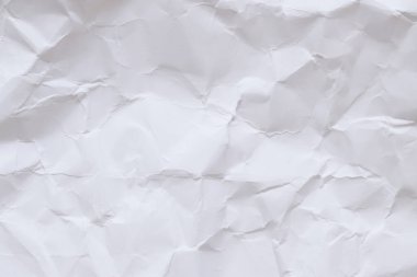 Buruşmuş beyaz kağıt arka plan. Buruşmuş beyaz kağıt dokusu ya da kağıt arkaplan. Kopyalama alanı olan ışık arkaplanı. Üst görünüm