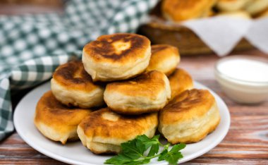 Delicious homemade pies with stuffing on the table. Close-up. Selective focus.