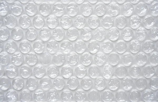 The texture of the packaging bubble film. Abstract background. Close-up. Selective focus.