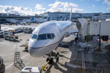San Francisco, Dec 12, 2022. United Airlines airplane ready for boarding, viewed from the glass window of the San Francisco International airport, front view of aircraft