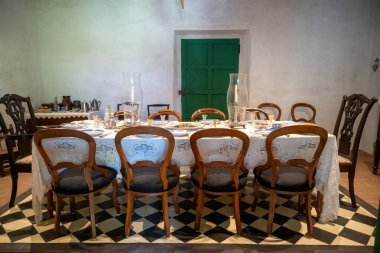 San Diego, CA. April 7, 2024.  Dinning room with table set for dinner, estudillo house in Old Town clipart