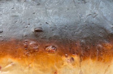 This is the skin of bread baked using a temperature that is too high. clipart