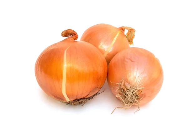 stock image Onions. Three onions on white background. Minerals from onions that are beneficial to the body such as magnesium, herbal treatment for different types of allergies, such as high blood pressure.