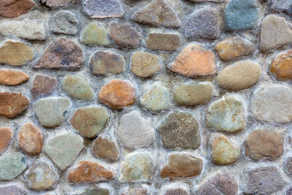Small rocks placed  in order to beautiful and fastened by cement. Use a flooring and walls, decorative home and garden.