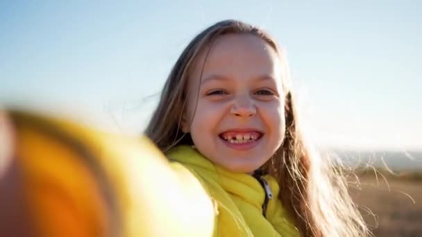 Little Cute Girl Holds Device Recording Video Make Videoblog Pose — Stock Video