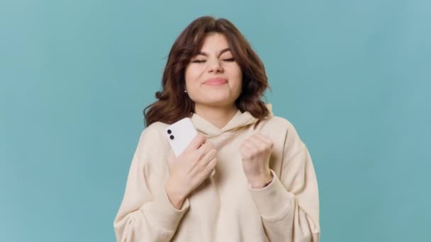 Enthusiastic Hopeful Teenage Girl Excitedly Browsing Commerce Website Smartphone Blue — Αρχείο Βίντεο