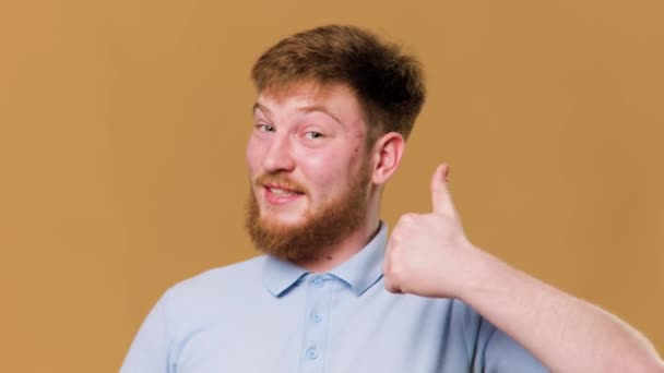 Smiling Teen Guy Gives Thumbs Studio Shot Exuding Happiness Satisfaction — Vídeo de Stock