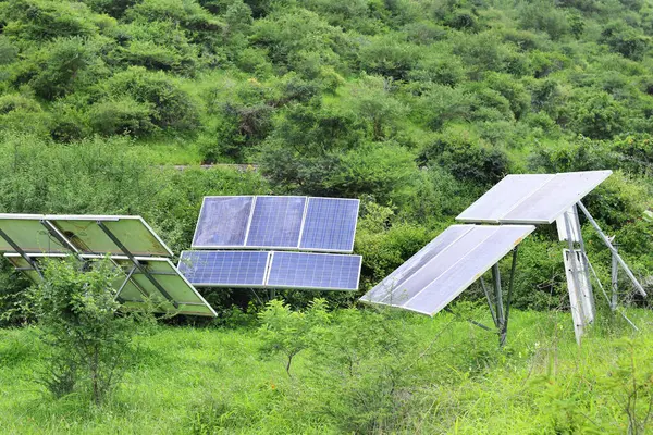 lose-up of Solar cell farm power plant eco technology. landscape of Solar cell panels in forest and farmland. Concept of renewable energy. Ecologically, clean energy. Eco, green energy. Solar cells.