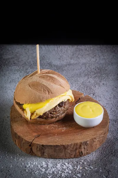 Craft beef burger with australian bread, cheese and honey mustard sauce.